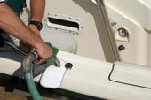 Catch drips with an absorbent “fuel bib” when you fuel your boat. Photo courtesy of BOAT US Foundation.